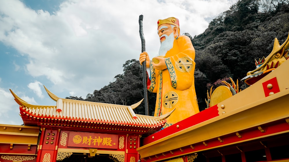 gold and red hindu deity statue