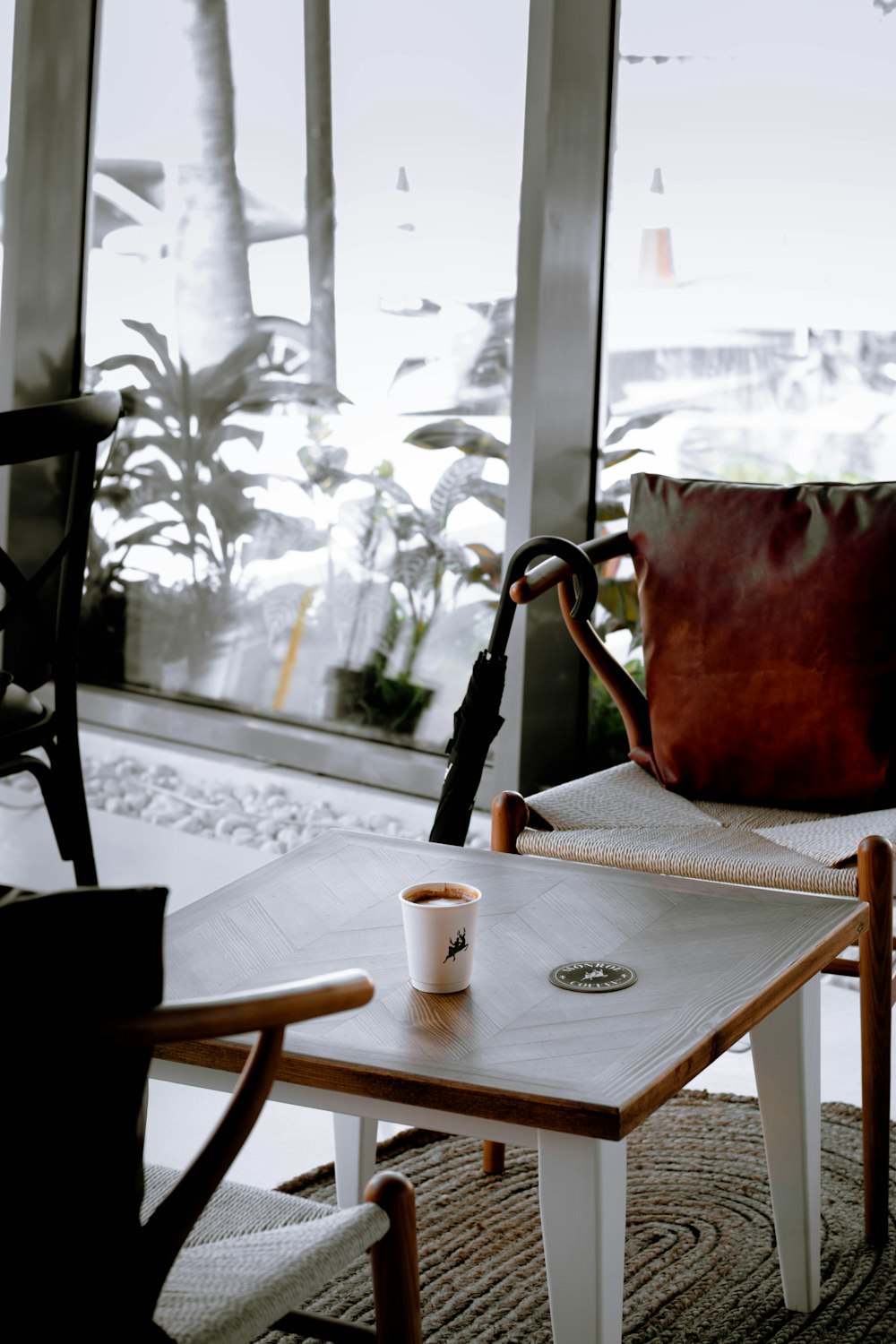 red ceramic mug on white table