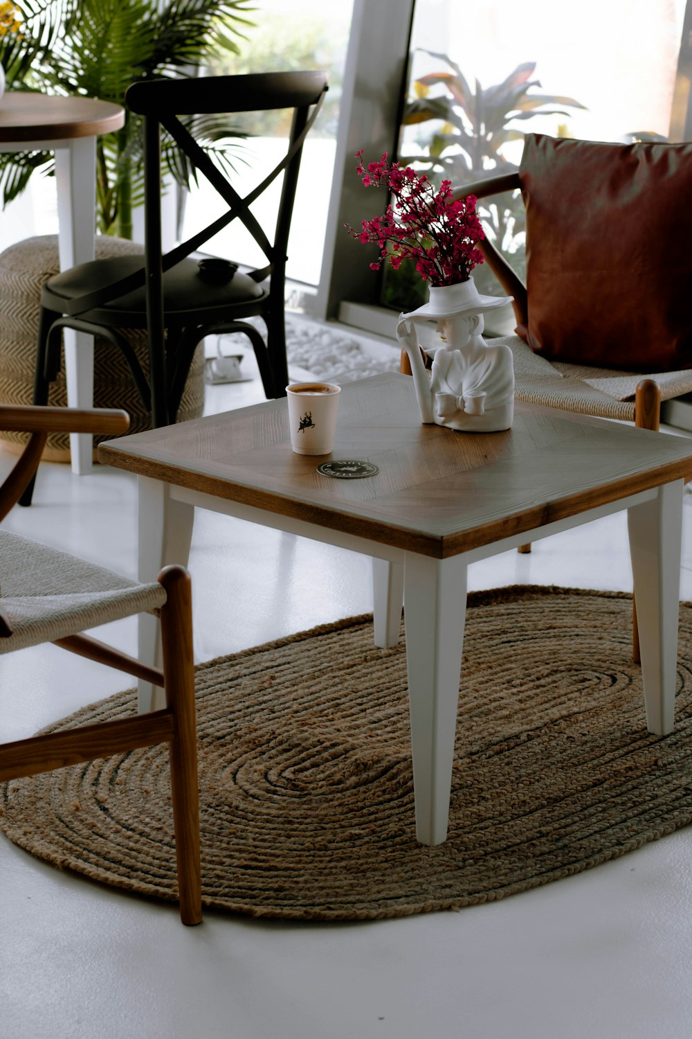 white ceramic mug on white wooden table