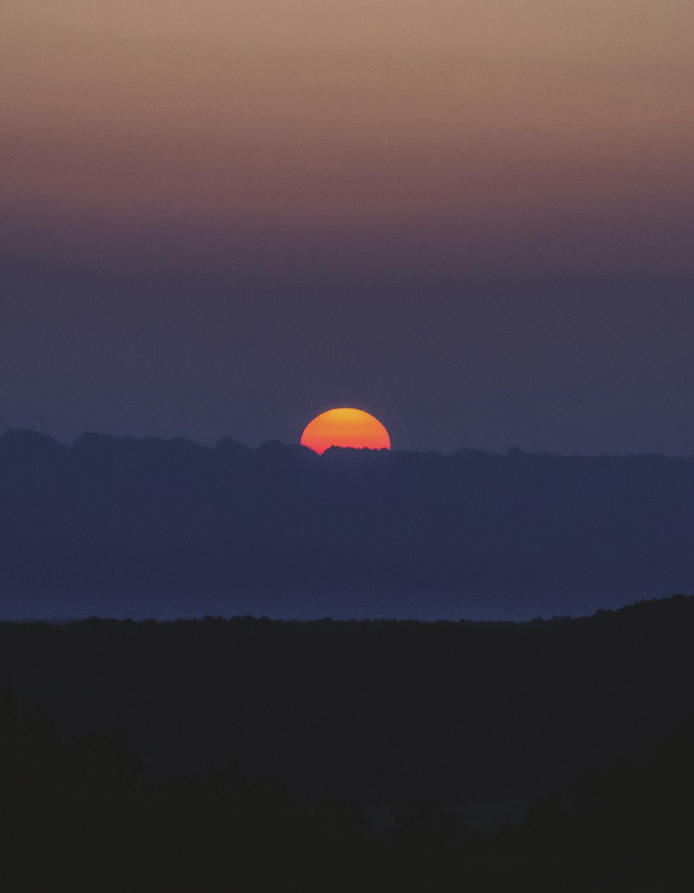 silhouette of mountain during sunset