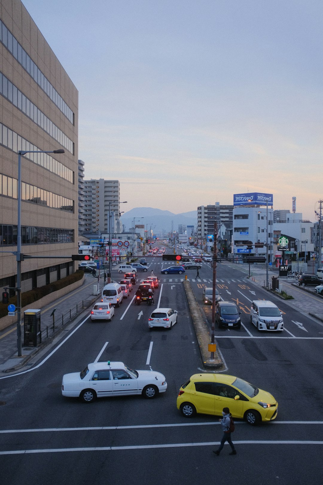 cars on road near buildings during daytime