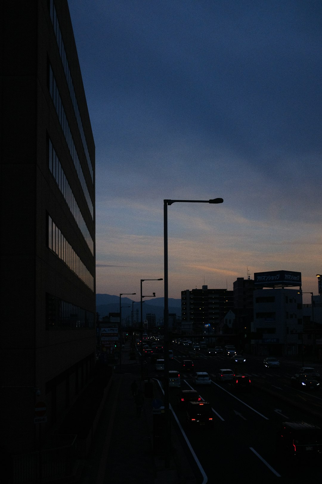 cars parked on side of the road during night time