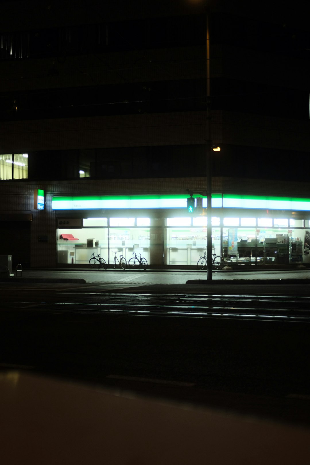 white and green glass building during night time