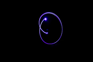 A sleek neon purple pulse wave glowing against a dark modern background, symbolizing digital energy.