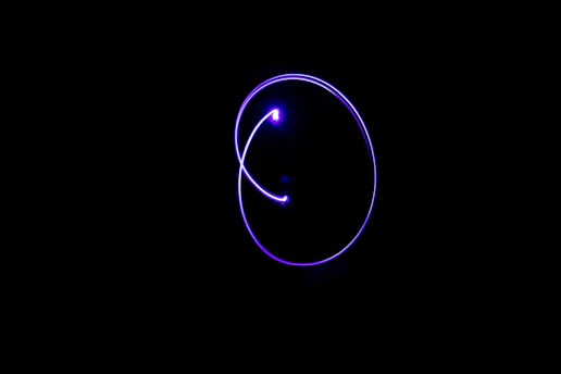 A sleek neon purple pulse wave glowing against a dark modern background, symbolizing digital energy.
