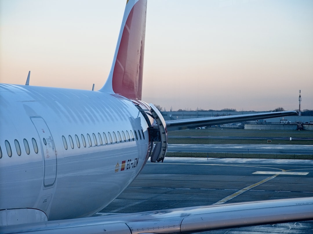 white passenger plane on airport during daytime