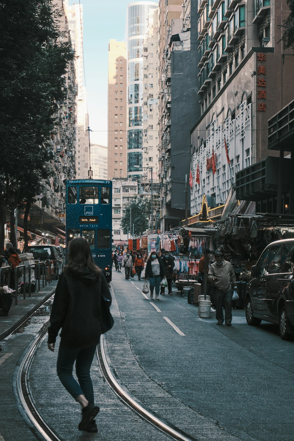 people walking on sidewalk during daytime