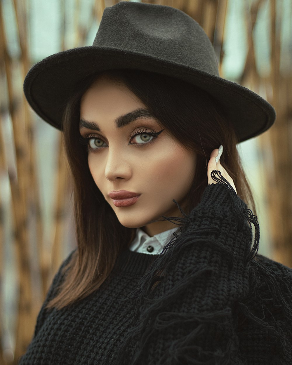 woman in black hat and black sweater