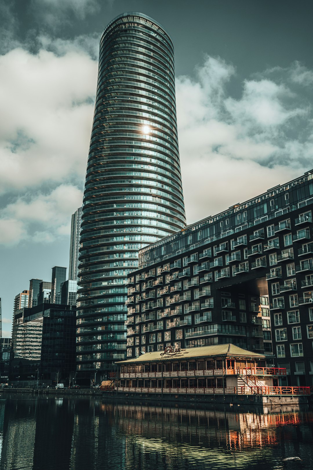 black and gray concrete building under gray clouds