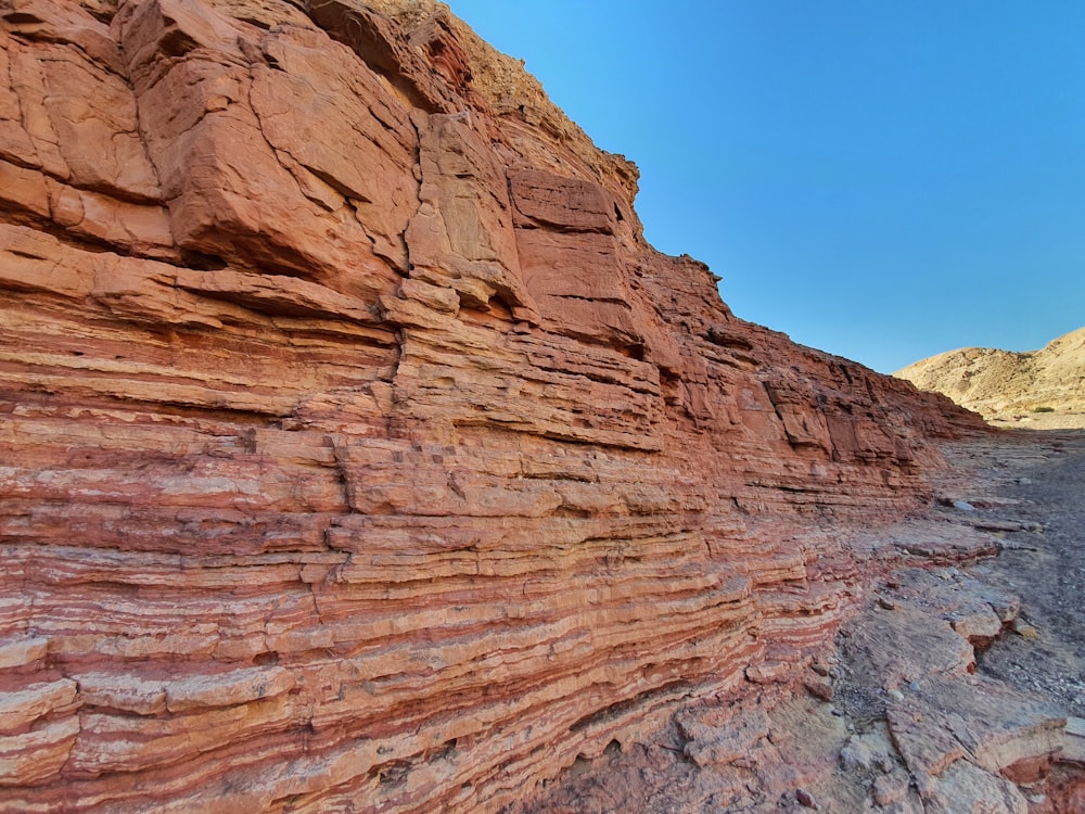 brown rock formation under blue sky during daytime