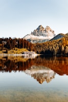 A scenic landscape puzzle showing a serene mountain lake reflecting autumn trees.