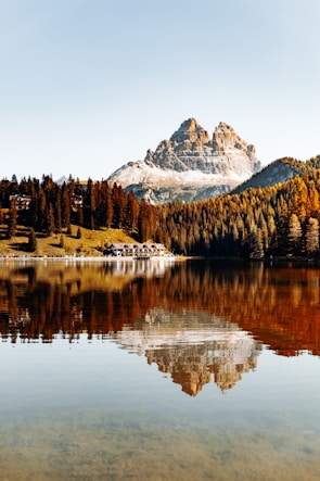 A scenic landscape puzzle showing a serene mountain lake reflecting autumn trees.