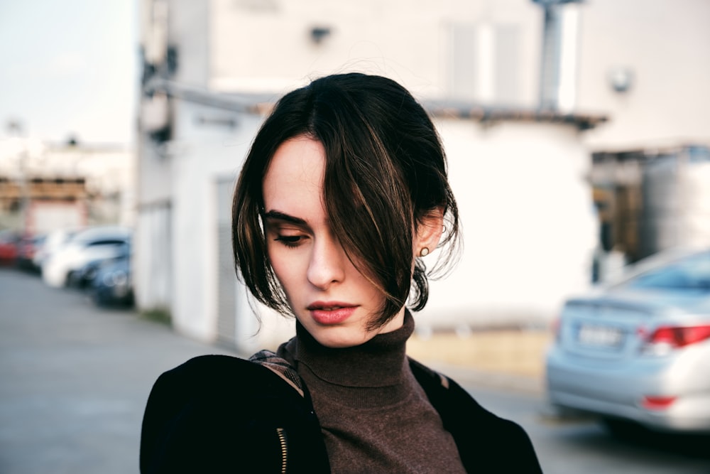 woman in black turtle neck shirt and black jacket