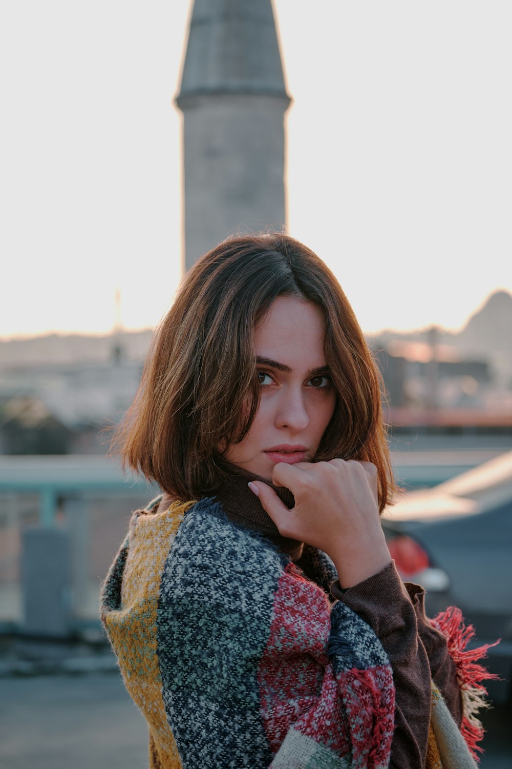 woman in brown and white scarf