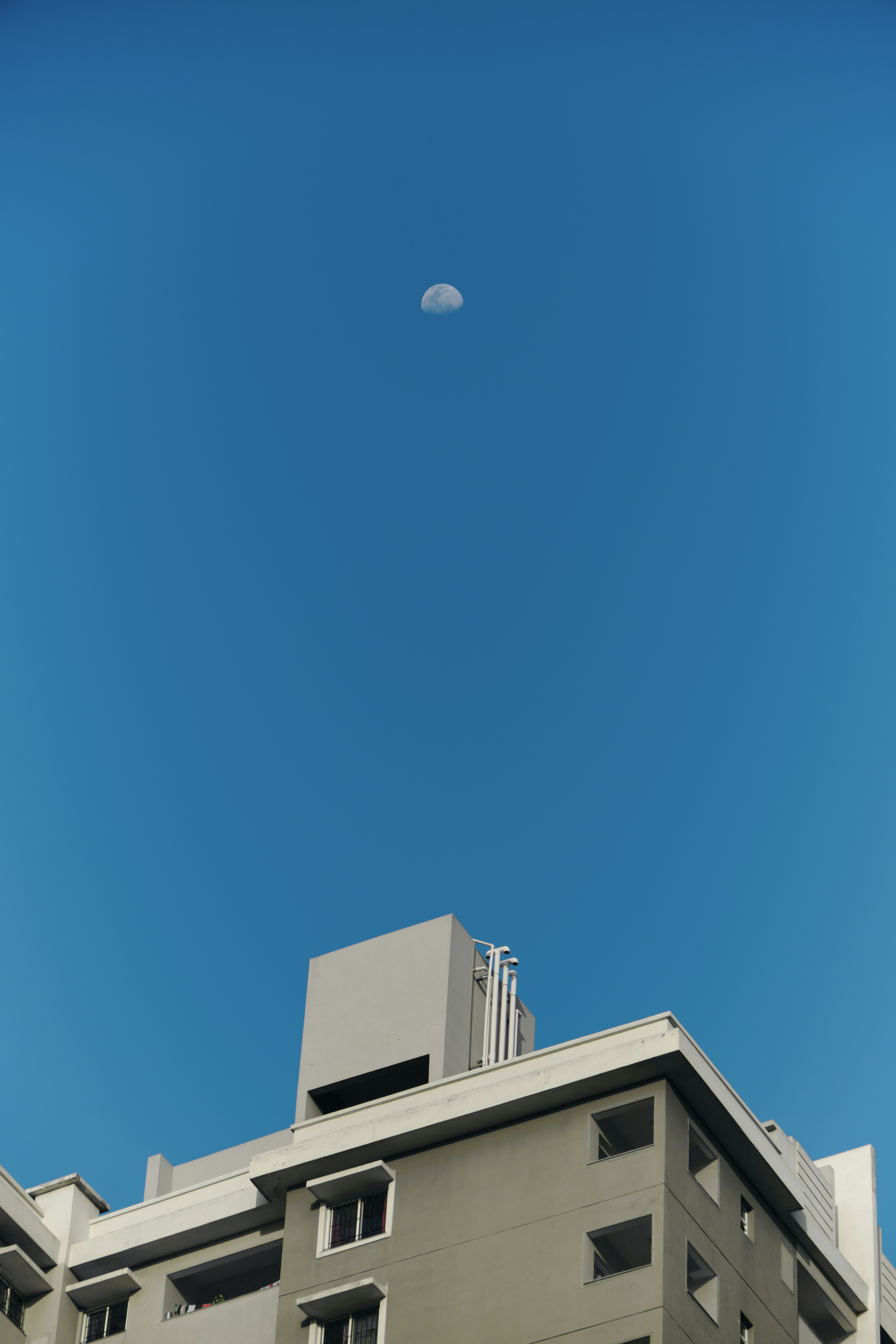 white concrete building under blue sky during daytime
