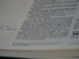 A close-up of a manuscript page showing carefully edited text with handwritten notes in the margins.