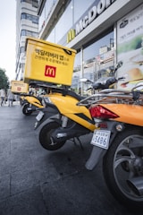 yellow and black sports bike parked beside black motorcycle