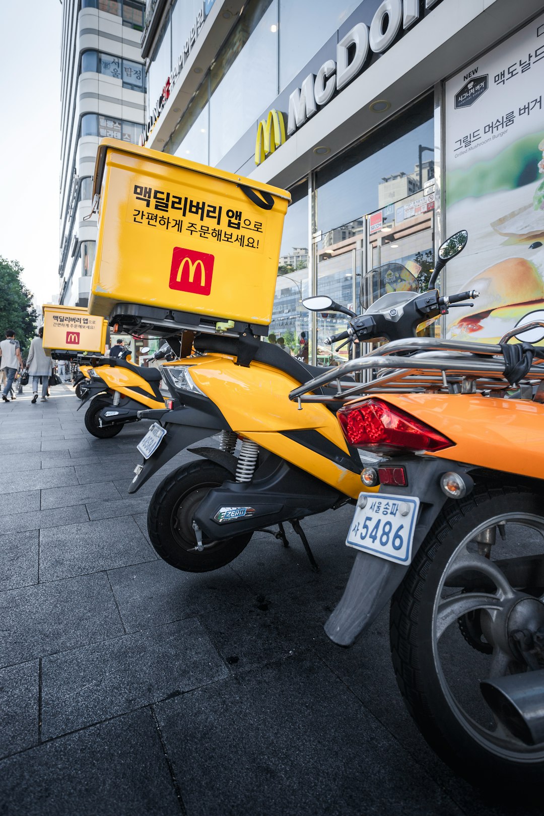 yellow and black sports bike parked beside black motorcycle