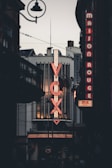 a large neon sign on the side of a building