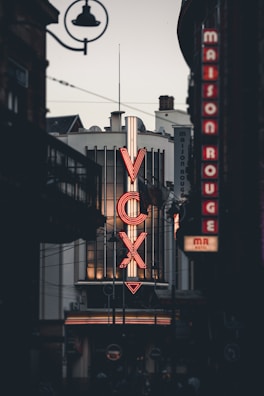 a large neon sign on the side of a building