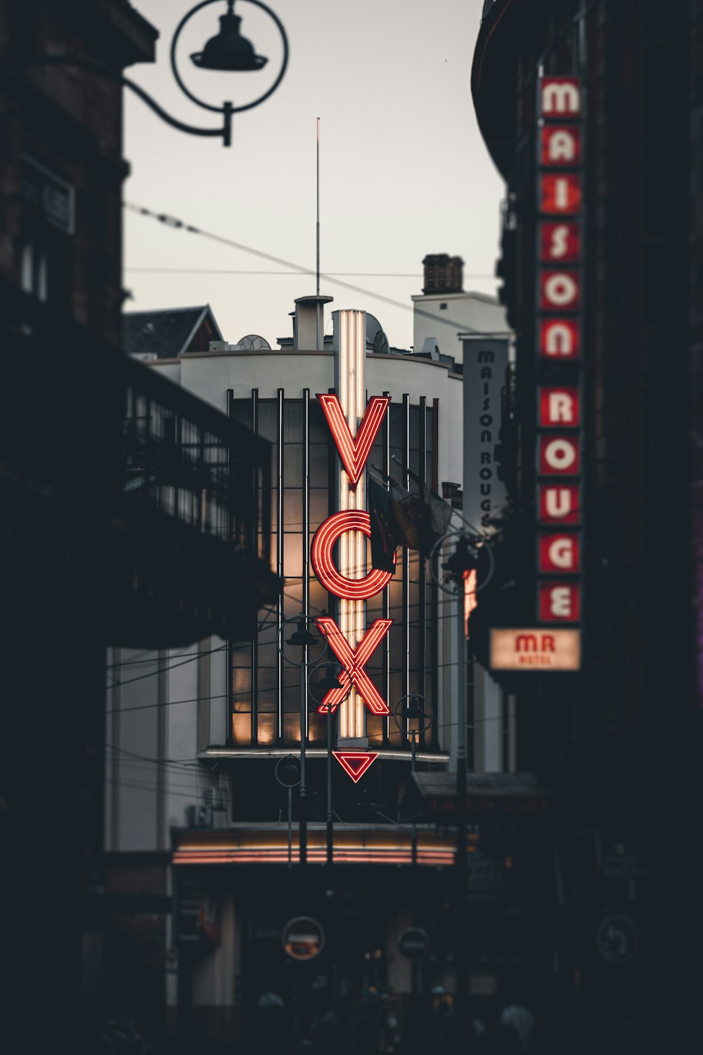 a large neon sign on the side of a building