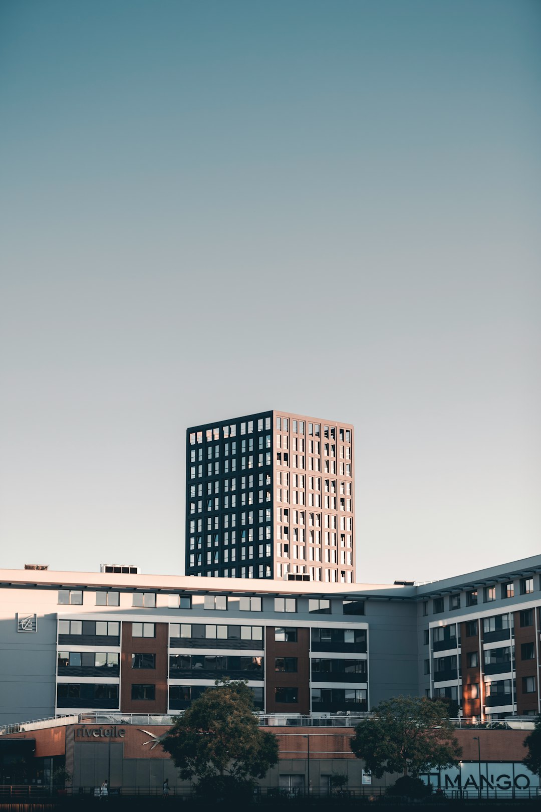 white and brown concrete building under blue sky during daytime