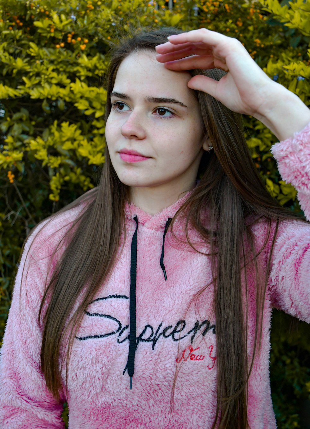 woman in pink and white zip up hoodie