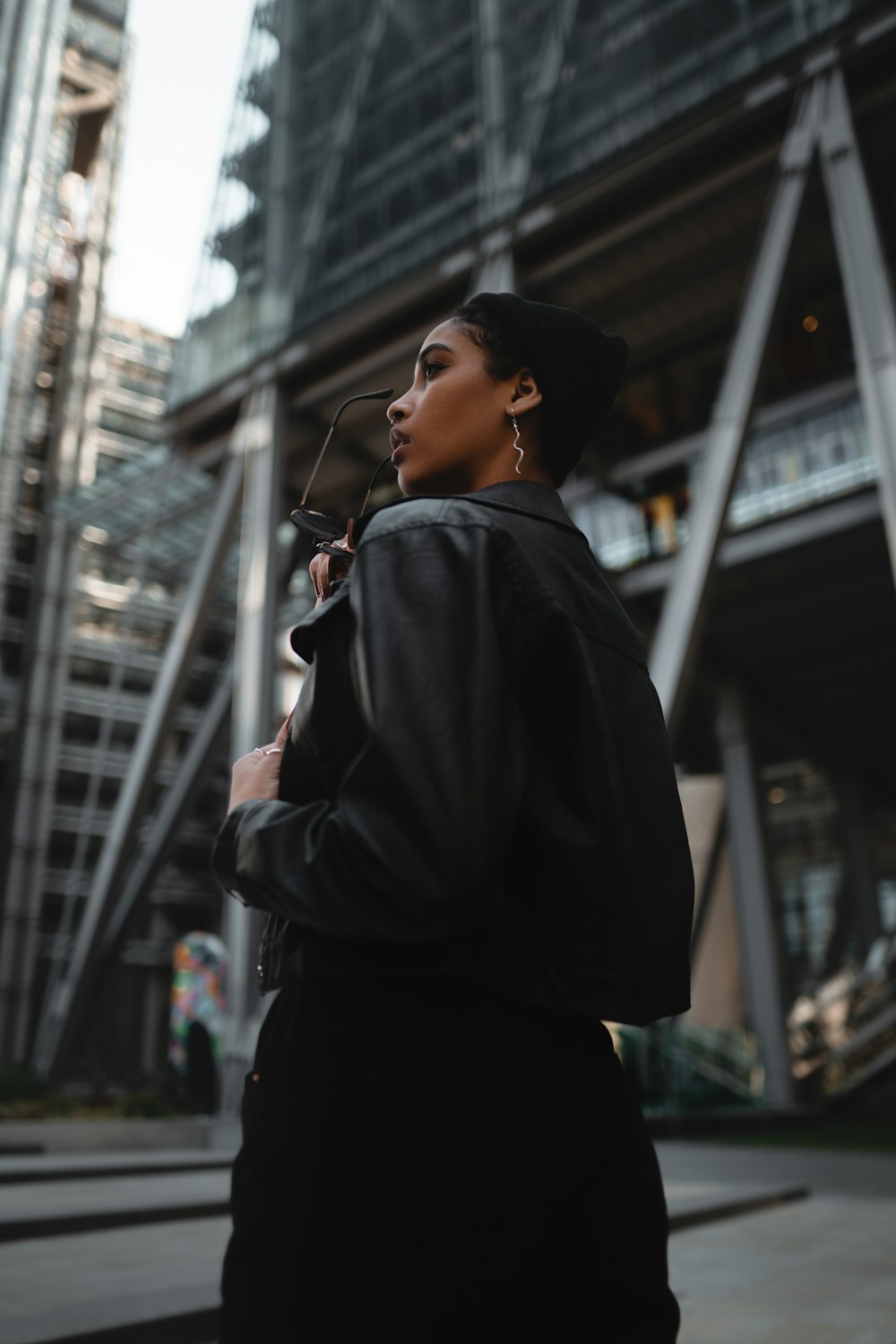 man in black jacket wearing black headphones