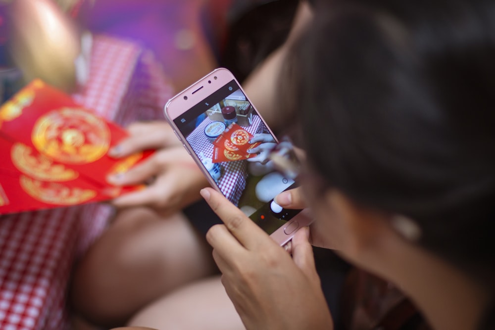 woman holding silver iphone 6