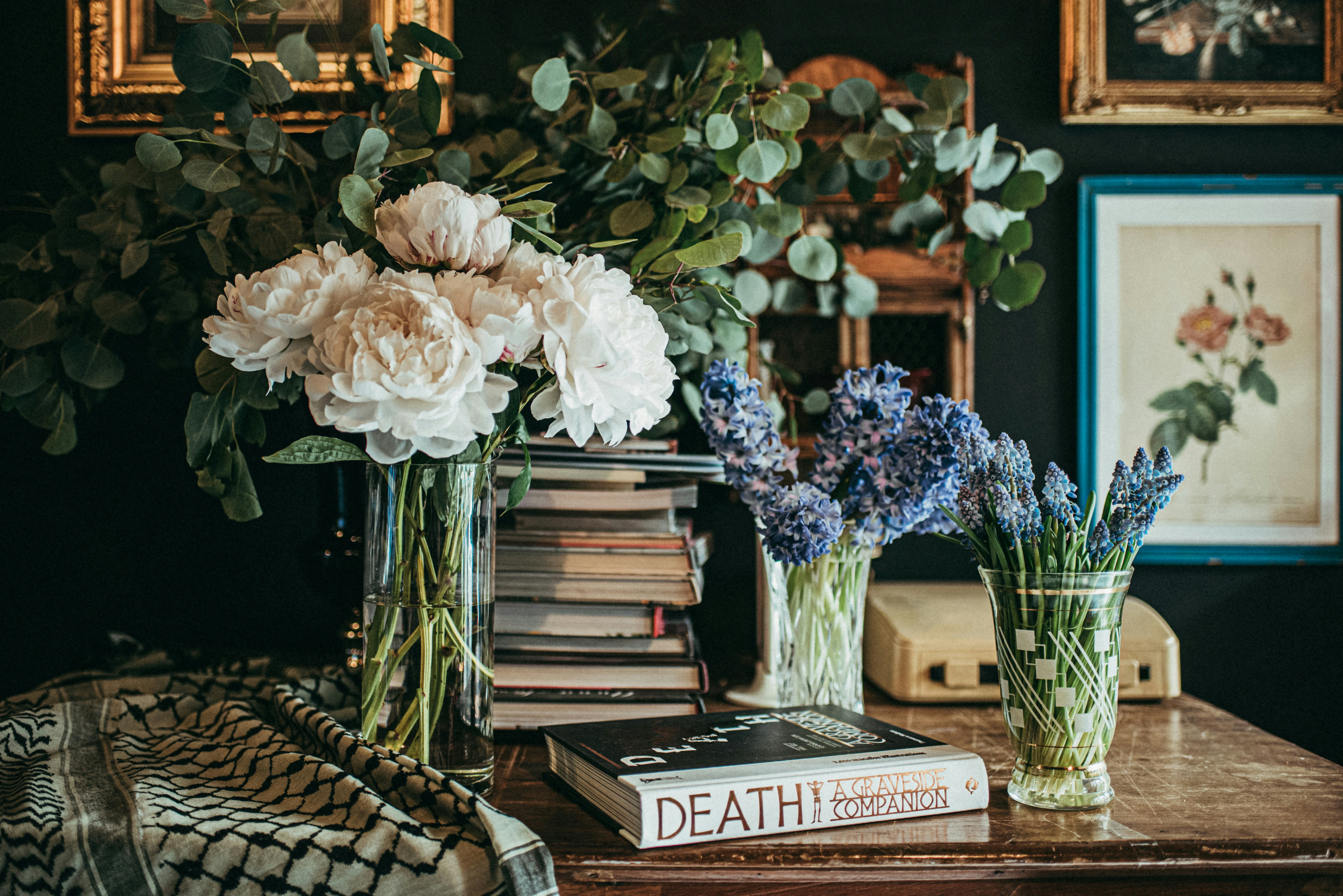 white flowers in clear glass vase