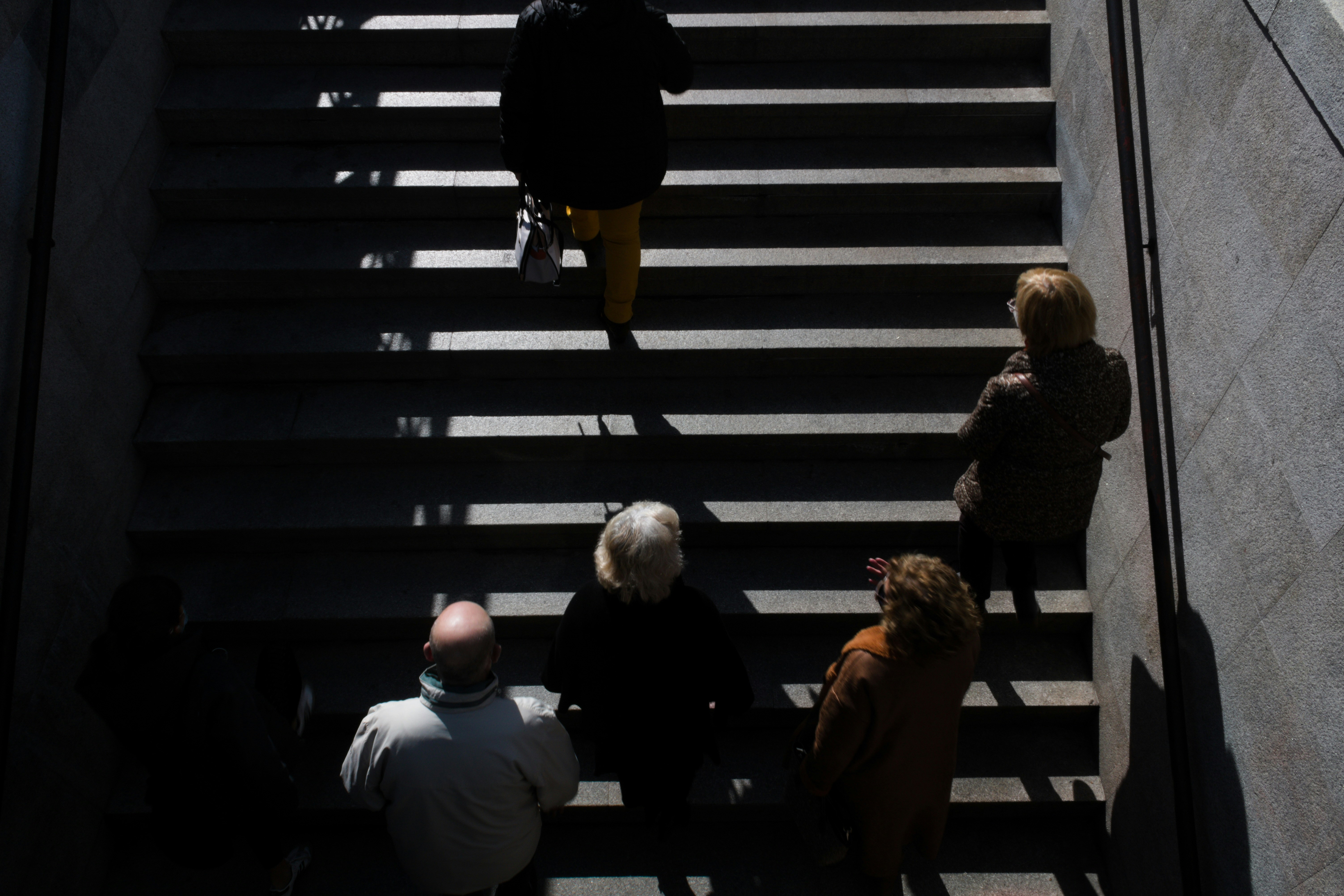 3 women sitting on stairs