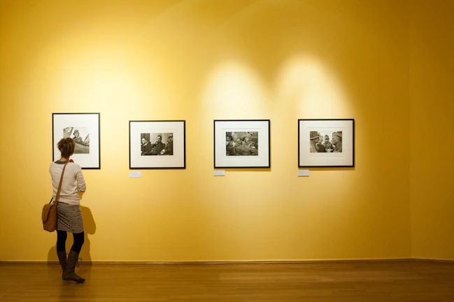 3 black wooden framed wall mounted photos