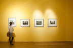 3 black wooden framed wall mounted photos