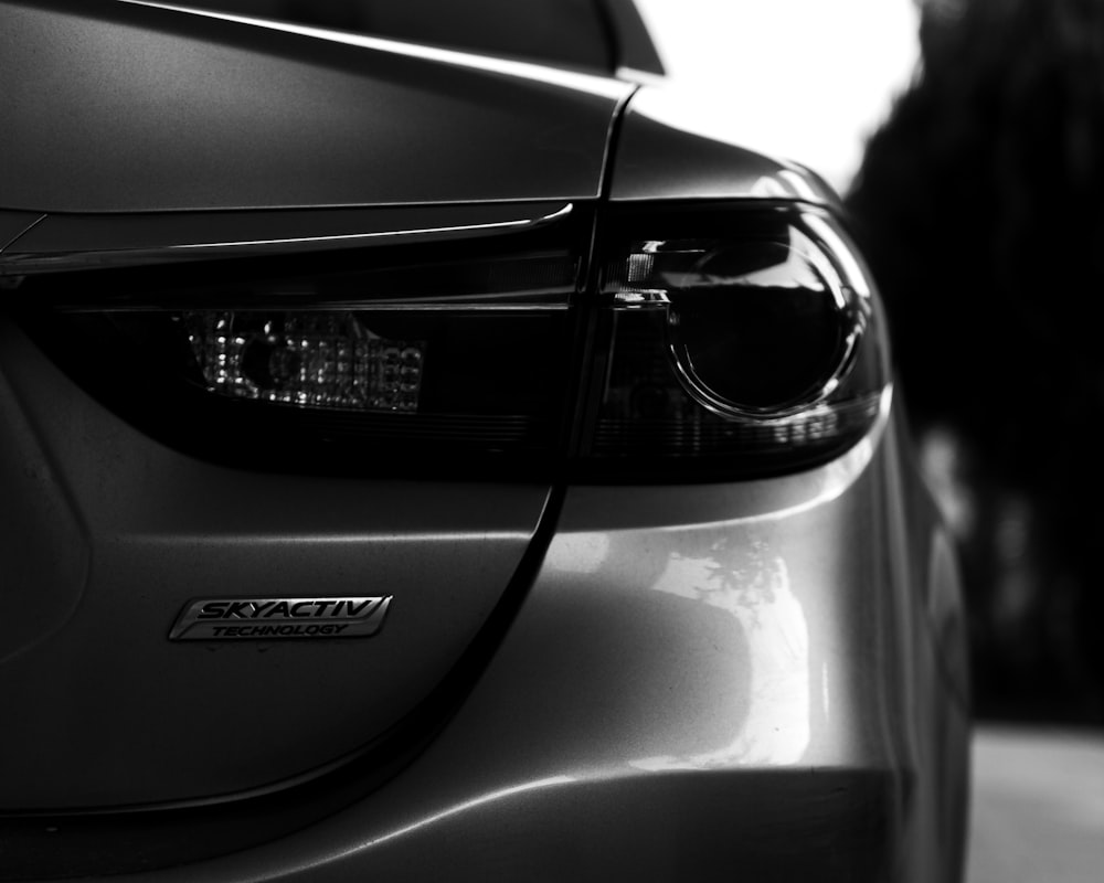 grayscale photo of car headlight