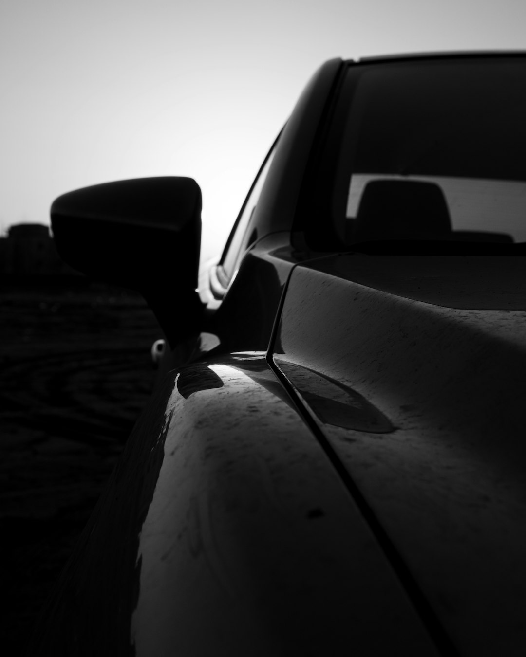 grayscale photo of car on road