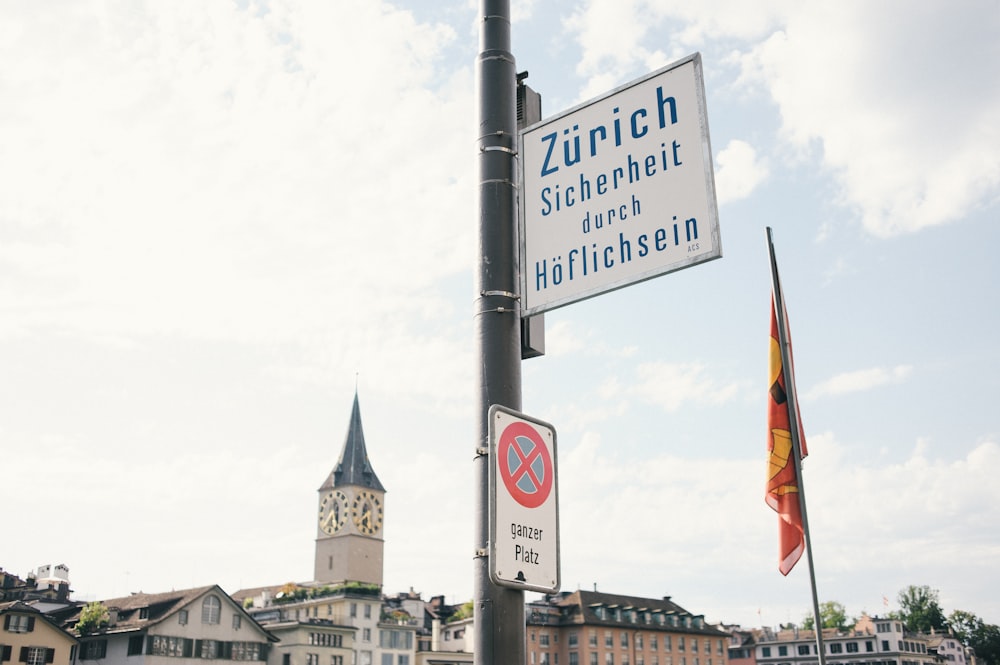 blue and white street sign