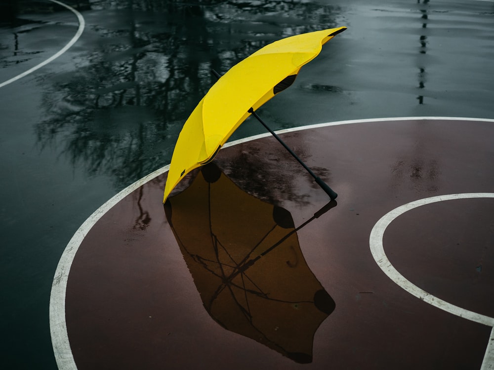 yellow umbrella on water during daytime
