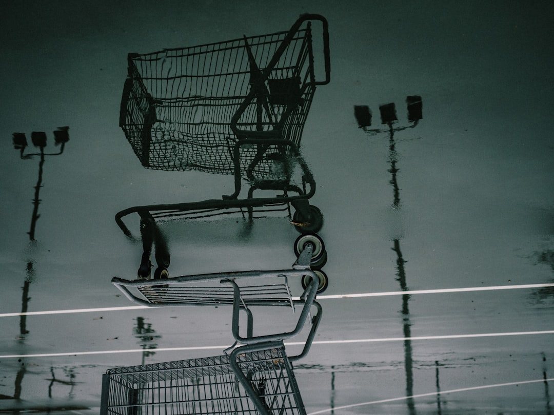 black shopping cart on white floor