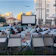 Inflatable projection screen set up in a lush green park during a sunny day event.