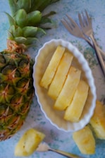 Screenshot of Meal Quest gameplay showing the pineapple character in the magical fridge realm.