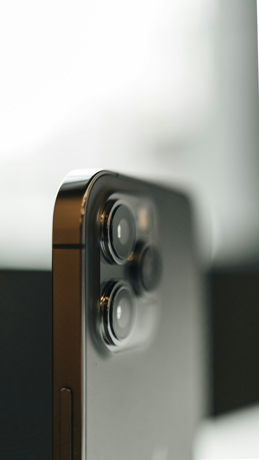 brown and silver speaker on white table