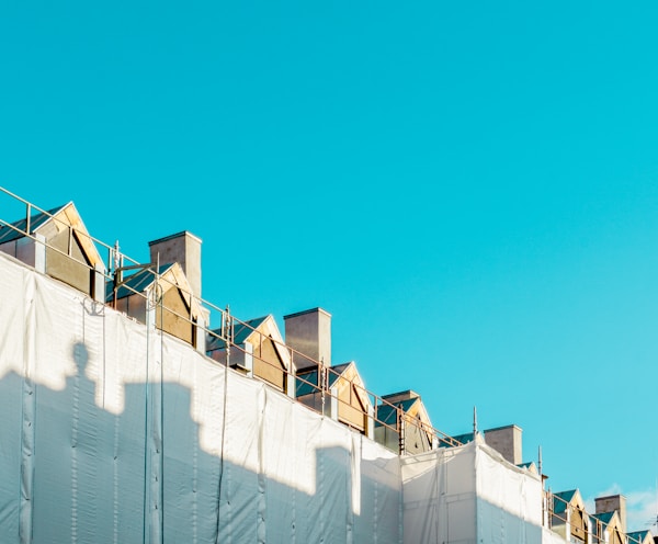 white concrete building under blue sky during daytime