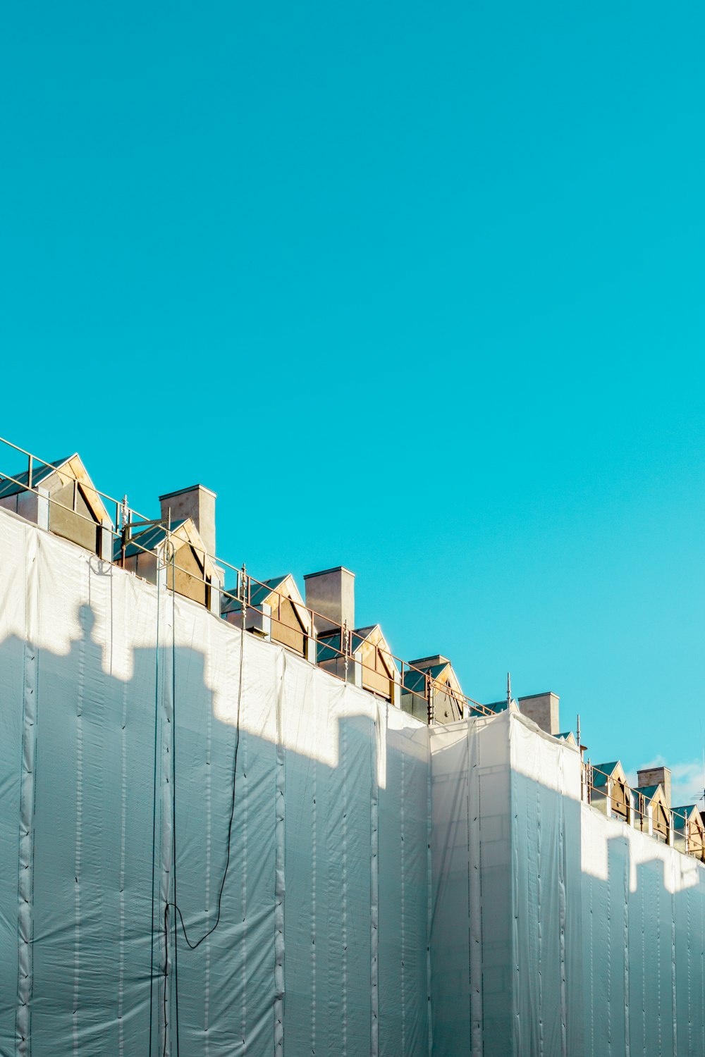 white concrete building under blue sky during daytime