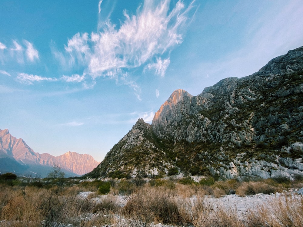 brown and green mountains under blue sky during daytime