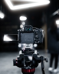 Imran Ali filming a gadget review in a modern studio setup.