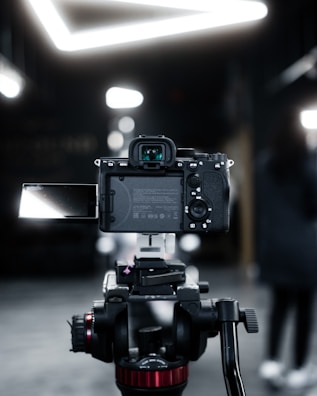 A behind-the-scenes shot of an influencer setting up their camera for a promotion.