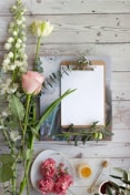 pink tulips on white book