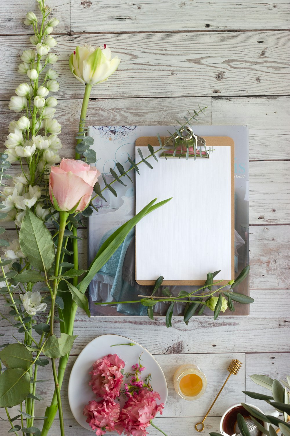 pink tulips on white book