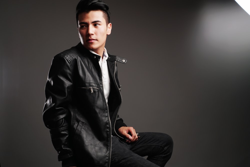 man in black leather jacket