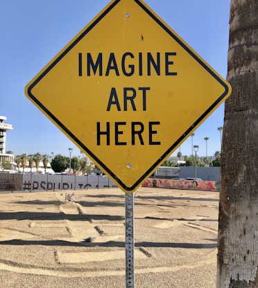 a yellow sign that says imagine art here